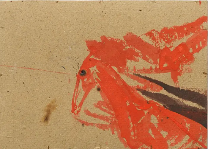 rote Farbe auf braunem Untergrund